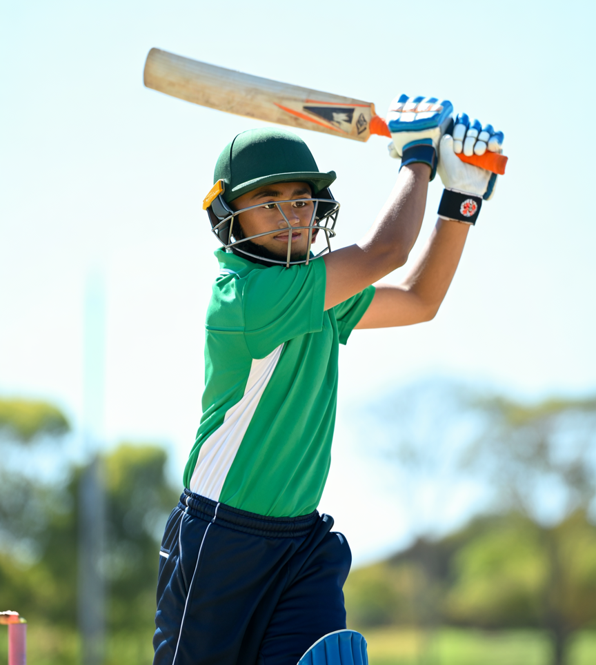 Cricket player batting outdoors